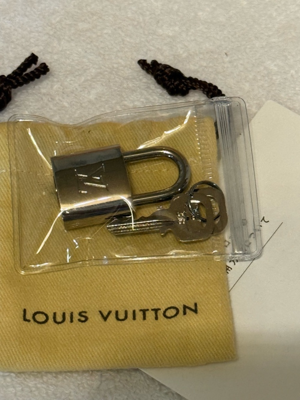 Louis Vuitton Silver-Tone Padlock with Branded  Dust Bag and Box.